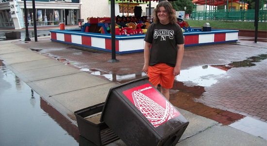 Sarah and a blown over trash can